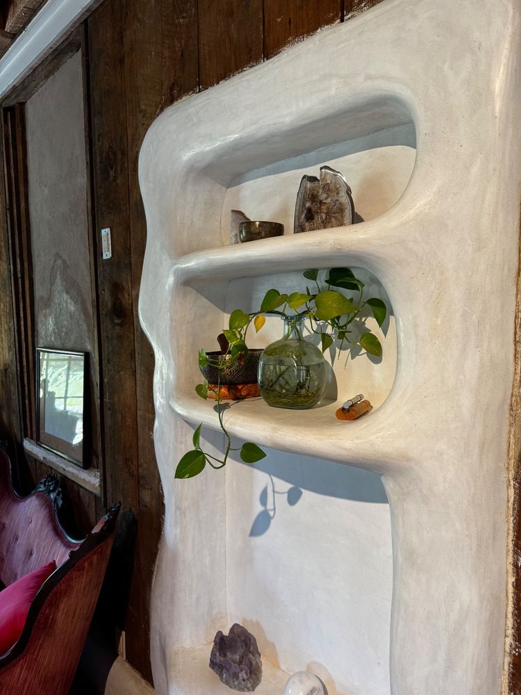 Sculpted plaster wall niche with shelves at The Tavern