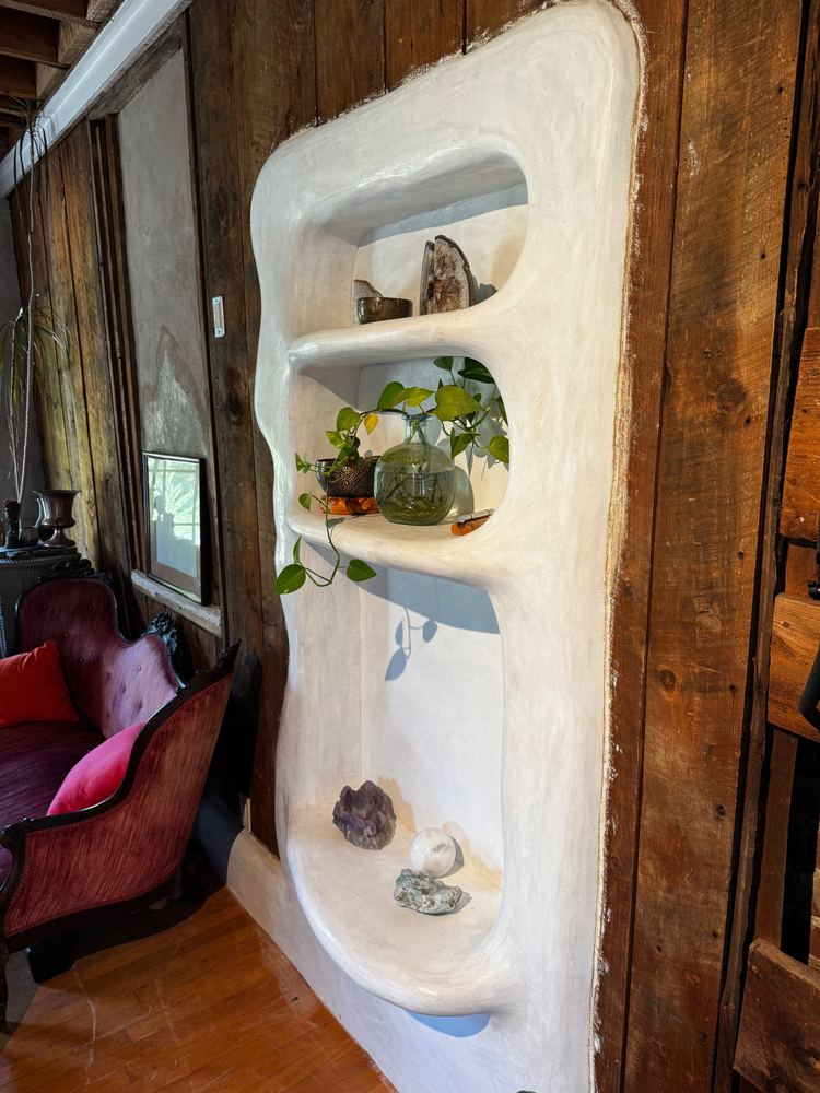 Sculpted plaster wall niche with shelves at The Tavern